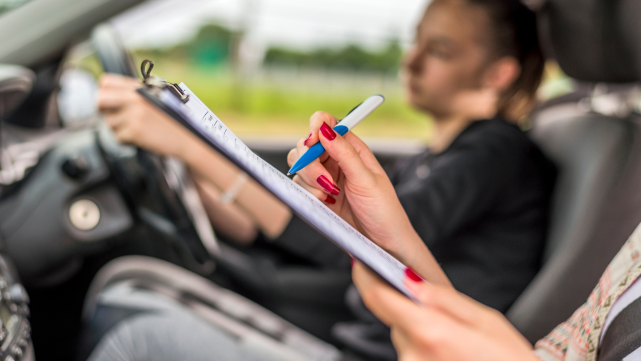 An instructor evaluates a delivery driver, showcasing the shift from manual to data-driven coaching for safety and efficiency in delivery.